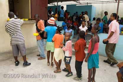 fr-gerard-jean-justes-church-st-clair-still-feeding-3000-a-day-0609-c-by-randall-white, The blood pours: UN soldiers shoot at Haitian mourners outside church funeral of Father Jean Juste in Haiti, World News & Views 