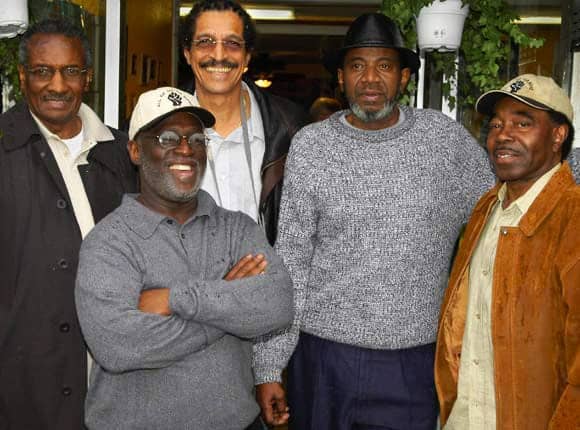 John Bowman, backed here by Hank Jones, Ray Boudreaux, Harold Taylor and Richard Brown of the SF 8, would have been arrested with them if he hadn’t died the month before. One of the three who were tortured by New Orleans police in 1973 at the behest of San Francisco police, he said in the film, “Legacy of Torture”: “The same people who tried to kill me in 1973 are the same people who are here today, trying to destroy me. I mean it literally. I mean there were people from the forces of the San Francisco Police Department who participated in harassment, torture and my interrogation in 1973 ... None of these people have ever been brought to trial. None of these people have ever been charged with anything. None of these people have ever been questioned about that.” – Photo: Scott Braley