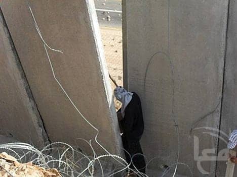 Nilin-walking-through-the-wall-091809, Ni'lin protesters tear down apartheid wall, World News & Views 