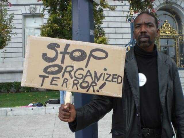 Marlon-Crump-at-anti-torture-protest-101409, I am unarmed! Don’t shoot!, Local News & Views 