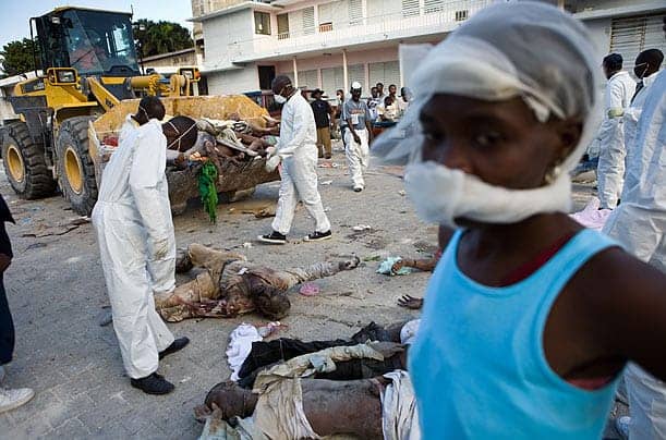 Haiti-earthquake-bodies-in-bulldozer-by-Timothy-Fadek-Polaris-for-TIME, The media called: Earthquake victims still await help, I say, World News & Views 