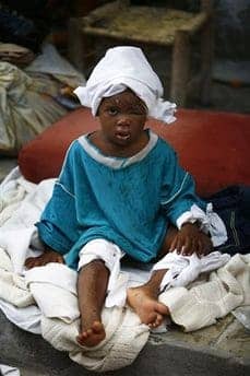 Haiti-earthquake-injured-baby-011410-by-Roshin-Rowjee, The Haitian tragedy and mainstream media response, World News & Views 