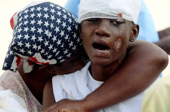 Haiti-earthquake-mother-embraces-injured-son-012110-by-McNamee-Getty, Kouraj cherie: Dispatches from Port au Prince, Haiti, World News & Views 