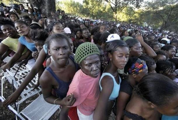 Haiti-earthquake-2000-women-line-up-for-1-liter-of-water-each-from-US-Army-in-PAP-golf-course-012010-by-AP1, Three in a million: Voices from the Haitian camps, World News & Views 