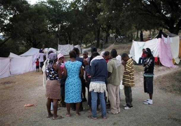 Haiti-earthquake-people-pray-in-PAP-camp-011810-by-AP, Three in a million: Voices from the Haitian camps, World News & Views 