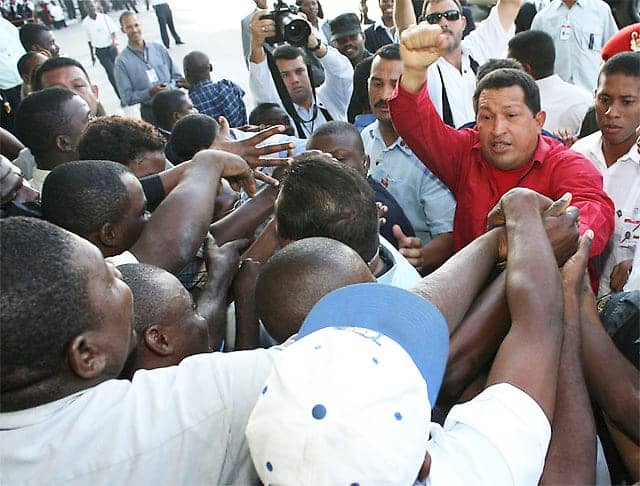 Haitians-welcome-Hugo-Chavez-0408-bringing-364-tons-of-food-by-VenWorld, Venezuela rushes aid to Haiti, World News & Views 