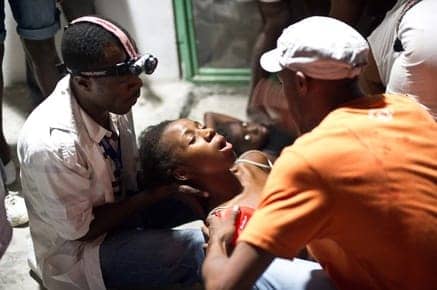 Haiti-earthquake-Cuban-doctors-treat-woman-0110, The Haiti response: Guns or doctors?, World News & Views 