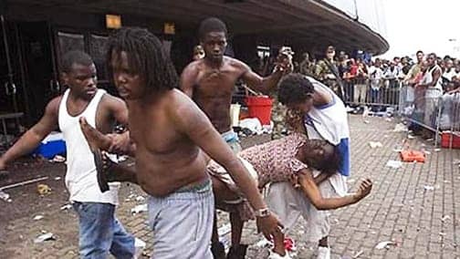 Young-Katrina-survivors-carry-woman-at-New-Orleans-Convention-Center-0905, Haiti help or Haiti hoodwink?, World News & Views 