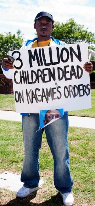 Anti-Kagame-protest-at-Oklahoma-Christian-University-3-mil-children-dead-sign-re-Congo-043010-by-Kendall-Brown2, A critique of 'Rwanda: The Two Faces of Paul Kagame' by Jon Rosen, World News & Views 