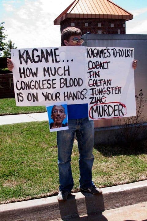 Anti-Kagame-protest-at-Oklahoma-Christian-University-sign-re-Congo-043010-by-Kendall-Brown1, Lawsuit alleges Rwandan President Kagame’s guilt in Rwanda Genocide and Congo War, World News & Views 