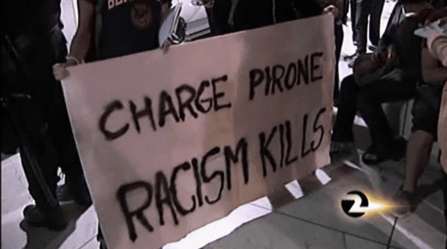 Charge-Pirone-Racism-Kills-banner-at-BART-protest-040810-by-KTVU, DA moves to force Tony Pirone’s return from North Carolina to testify at Mehserle's trial for murder of Oscar Grant, Local News & Views 