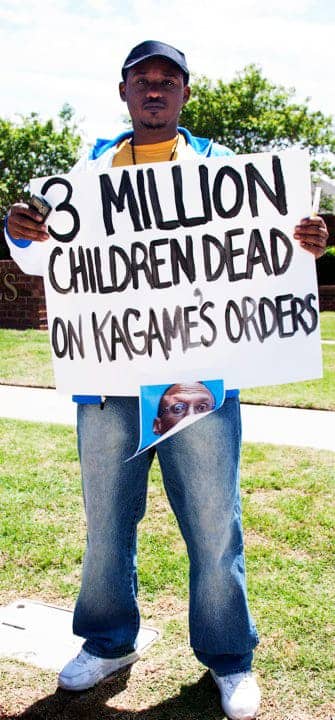 Anti-Kagame-protest-at-Okla.-Christian-Univ.-Claude-Gatebuke-3-mil-children-dead-sign-re-Congo-043010-by-Kendall-Brown, Deadly silence: Rwanda's never again is once again?, World News & Views 