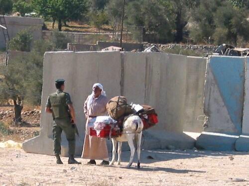 http://www.sfbayview.com/wp-content/uploads/bethlehem-checkpoint-soldier-stops-farmer-trying-to-bypass.jpg