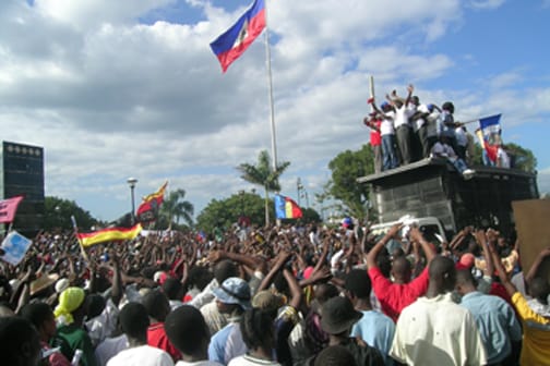 haiti-protest-marking-1st-free-election-lavalas-founding-121608-c-jean-ristil-hip-web, The rebirth of Konbit in Haiti, World News & Views 