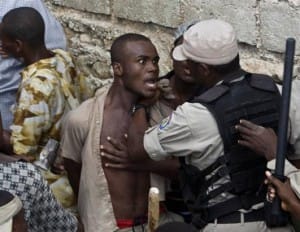 haiti-school-collapse-relative-vs-police-110908-by-ramon-espinosa-ap1-300x232, Haitian families furious over school collapse, World News & Views 